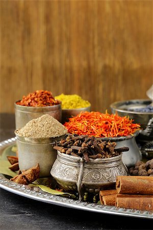 collection of various spices (paprika, turmeric, pepper, aniseed, cinnamon, saffron) Foto de stock - Super Valor sin royalties y Suscripción, Código: 400-06915668