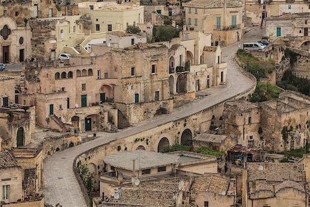 simsearch:400-07055926,k - A view at houses in the Sassi the historic center of the city Matera in Basilicata in Italy Photographie de stock - Aubaine LD & Abonnement, Code: 400-06916716