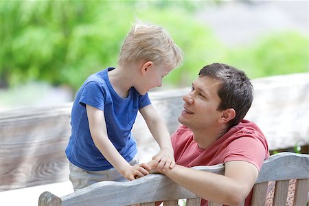 handsome young father looking at his cute son, family of two spending time outdoor Stock Photo - Budget Royalty-Free & Subscription, Code: 400-06917022