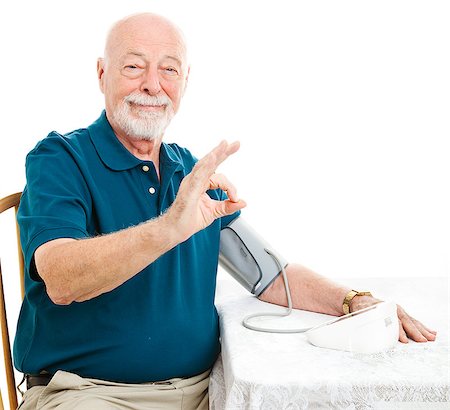 Senior man taking his blood pressure at home and getting a good result.  Giving Okay hand sign. Stock Photo - Budget Royalty-Free & Subscription, Code: 400-06917360