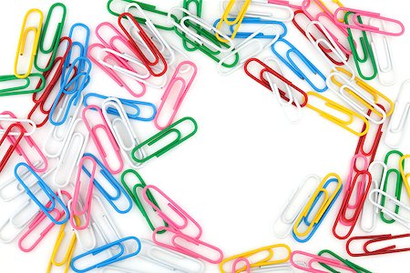 simsearch:400-04709840,k - Colored paper clips with empty space. Isolated on white Foto de stock - Super Valor sin royalties y Suscripción, Código: 400-06917399