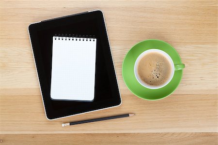 simsearch:400-06921233,k - Touch screen tablet computer, notepad, pencil and cup of coffee on wooden table Stock Photo - Budget Royalty-Free & Subscription, Code: 400-06917544