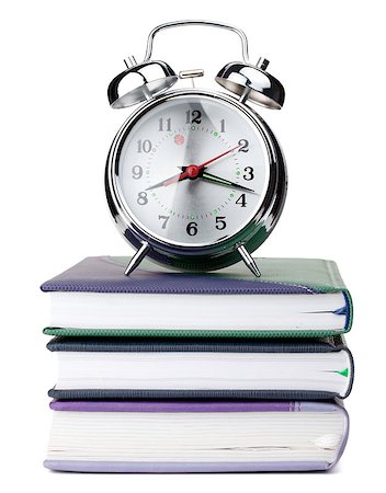 simsearch:400-04293721,k - Alarm clock on notepads and books. Isolated on white background Fotografie stock - Microstock e Abbonamento, Codice: 400-06917553