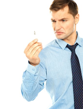 Angry smoker staring at cigarette isolated against white background Stock Photo - Budget Royalty-Free & Subscription, Code: 400-06917698