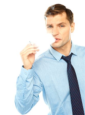 Young businessman smoking cigarette on a white background Stock Photo - Budget Royalty-Free & Subscription, Code: 400-06917699