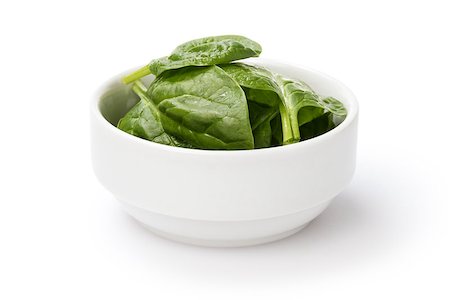 simsearch:400-05333490,k - fresh spinach leaves in bowl, isolated on white Photographie de stock - Aubaine LD & Abonnement, Code: 400-06918321