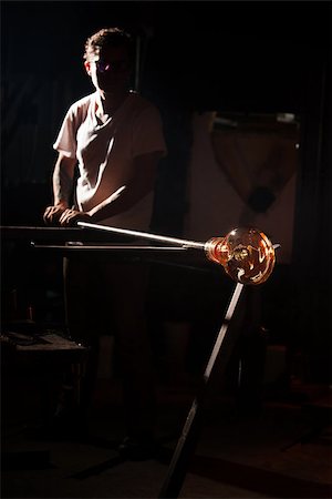 simsearch:400-06796868,k - Man working with hot glass object and rod indoors Foto de stock - Super Valor sin royalties y Suscripción, Código: 400-06918782