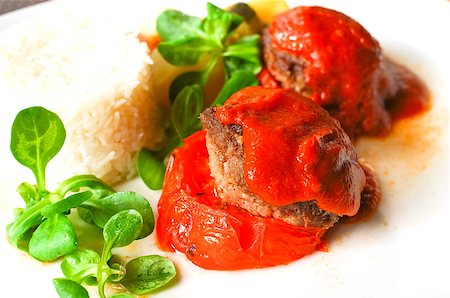 stuffed tomatoes with rice on a white plate Stock Photo - Budget Royalty-Free & Subscription, Code: 400-06919253