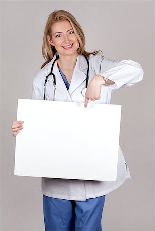 simsearch:400-05745246,k - blond female doctor posing on light grey background Photographie de stock - Aubaine LD & Abonnement, Code: 400-06919816