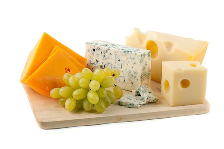 Cheese and grapes. Isolated on white Stock Photo - Budget Royalty-Free & Subscription, Code: 400-06919928