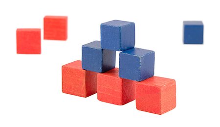 pyramid made of wood colorful toy log bricks blocks isolated on white. pink blue color construction. Stock Photo - Budget Royalty-Free & Subscription, Code: 400-06911911