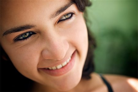 simsearch:400-07920877,k - Pretty girl with green eyes, portrait of happy young hispanic woman looking at camera and smiling. Sequence Stock Photo - Budget Royalty-Free & Subscription, Code: 400-06912238