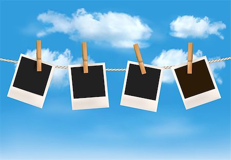 Background with photos hanging on a rope in front of a blue sky with clouds. Vector Stock Photo - Budget Royalty-Free & Subscription, Code: 400-06912267