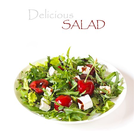 Delicious salad with arugula, sweet cherry and goat cheese. Stock Photo - Budget Royalty-Free & Subscription, Code: 400-06913249