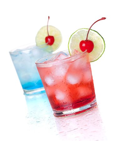 Two cocktails with lime slice and maraschino. Isolated on white background Stock Photo - Budget Royalty-Free & Subscription, Code: 400-06913516