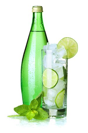Glass of water with lime, ice, mint and bottle with mineral water. Isolated on white background. Stock Photo - Budget Royalty-Free & Subscription, Code: 400-06913511