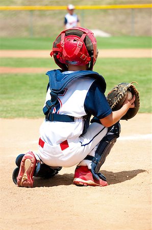 Youth baseball boy catching during a game. Stock Photo - Budget Royalty-Free & Subscription, Code: 400-06924252