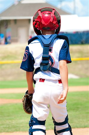 Youth baseball boy catching during a game. Stock Photo - Budget Royalty-Free & Subscription, Code: 400-06924253