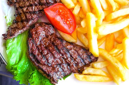 simsearch:400-05181259,k - juicy steak beef meat with tomato and french fries Foto de stock - Super Valor sin royalties y Suscripción, Código: 400-06924292