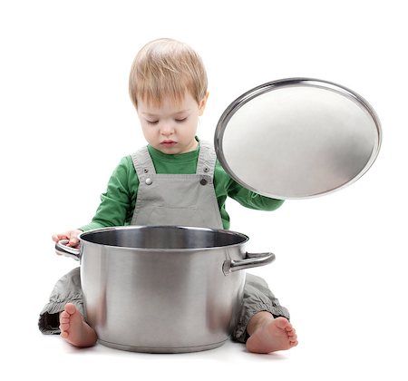 Baby looking inside saucepan. Isolated on white background Stock Photo - Budget Royalty-Free & Subscription, Code: 400-06924468