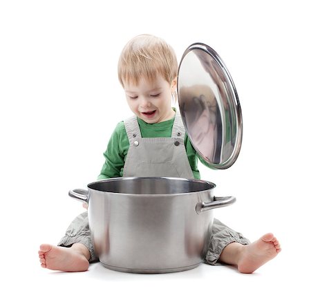 Baby looking inside saucepan. Isolated on white background Stock Photo - Budget Royalty-Free & Subscription, Code: 400-06924469