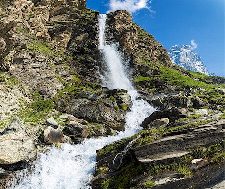 waterfall in the foreground and Mount Matterhorn in the background Fotografie stock - Microstock e Abbonamento, Codice: 400-06924598