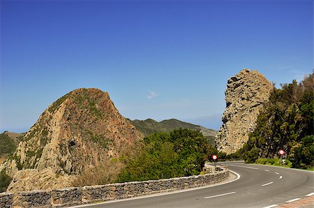 The winding road between hills covered in green vegetation, Spain La Gomera Stockbilder - Microstock & Abonnement, Bildnummer: 400-06924604
