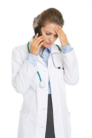 Concerned doctor woman talking mobile phone Stock Photo - Budget Royalty-Free & Subscription, Code: 400-06924690