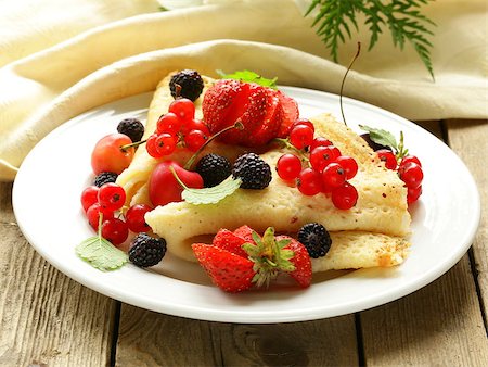 thin dessert pancakes (crepes) with various berries Stock Photo - Budget Royalty-Free & Subscription, Code: 400-06924749