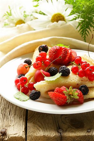 thin dessert pancakes (crepes) with various berries Stock Photo - Budget Royalty-Free & Subscription, Code: 400-06924756