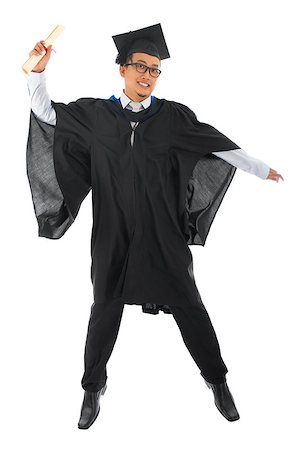 people graduation jump - Full body excited Asian male university student in graduation gown jumping isolated on white background Stock Photo - Budget Royalty-Free & Subscription, Code: 400-06924785