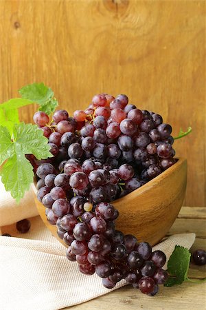organic ripe black grapes on a wooden table Stock Photo - Budget Royalty-Free & Subscription, Code: 400-06925035