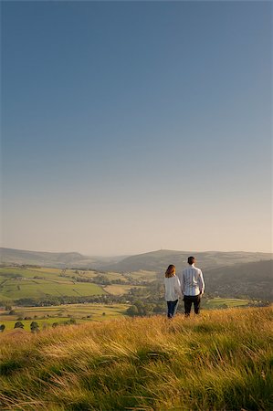 couple looking over a valley to hills beyond Stock Photo - Budget Royalty-Free & Subscription, Code: 400-06925162