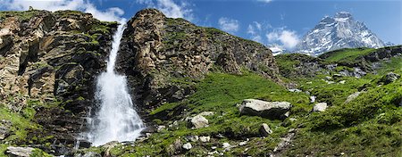 waterfall in the foreground and Mount Matterhorn in the background Fotografie stock - Microstock e Abbonamento, Codice: 400-06925180