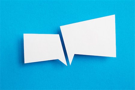 paper speech bubble on blue background Stock Photo - Budget Royalty-Free & Subscription, Code: 400-06925201