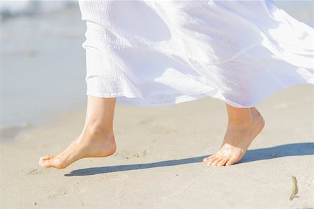 simsearch:400-04912125,k - Closeup on leg of young woman on sea coast Stock Photo - Budget Royalty-Free & Subscription, Code: 400-06925517