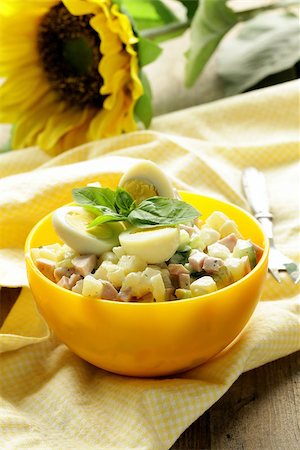 potato salad yellow - egg salad with quail eggs, cucumber and sausage Stock Photo - Budget Royalty-Free & Subscription, Code: 400-06926181