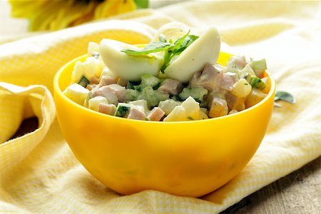 potato salad yellow - egg salad with quail eggs, cucumber and sausage Stock Photo - Budget Royalty-Free & Subscription, Code: 400-06926182