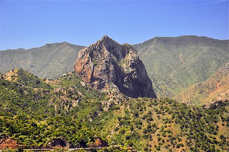 The peak in the beautiful green mountains on a blue sky Stockbilder - Microstock & Abonnement, Bildnummer: 400-06926316