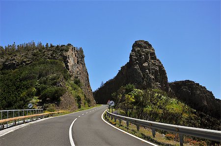 The winding road between hills covered in green vegetation, Spain La Gomera Stockbilder - Microstock & Abonnement, Bildnummer: 400-06926318
