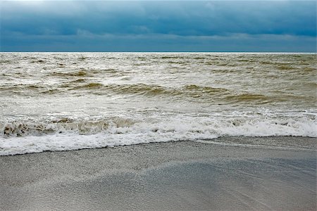 simsearch:400-07101779,k - Sea coast after the storm with contaminated water with sand dredged from the seabed Stock Photo - Budget Royalty-Free & Subscription, Code: 400-06926385