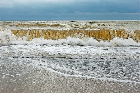 simsearch:400-07101779,k - Big stormy wave with sand contaminated water directed ashore Stock Photo - Budget Royalty-Free & Subscription, Code: 400-06926386