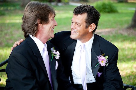 Gay couple celebrating their marriage together outdoors. Stock Photo - Budget Royalty-Free & Subscription, Code: 400-06926943