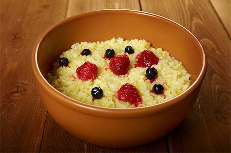 porridge and berries - Millet porridge with berry in brown bowl on table Stock Photo - Budget Royalty-Free & Subscription, Code: 400-06926982