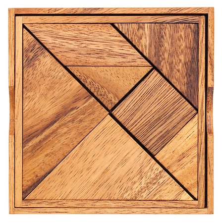 simsearch:400-07774007,k - Pieces of a traditional Chinese Puzzle Game made of different wood parts to build abstract figures from them, isolated on white Foto de stock - Royalty-Free Super Valor e Assinatura, Número: 400-06928079