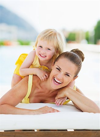Portrait of happy mother and baby at poolside Stock Photo - Budget Royalty-Free & Subscription, Code: 400-06928320