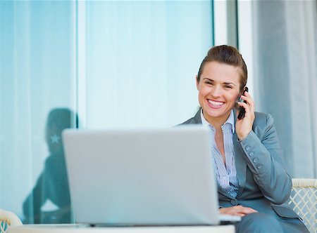 simsearch:400-07106831,k - Happy business woman talking mobile phone on terrace Stockbilder - Microstock & Abonnement, Bildnummer: 400-06928337