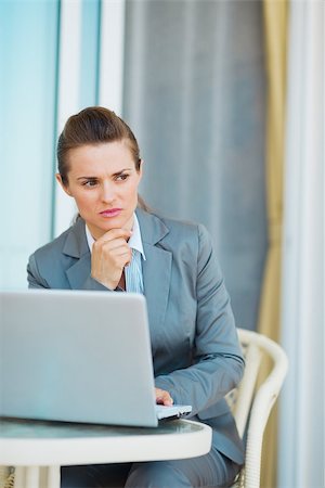 simsearch:400-04287211,k - Thoughtful business woman working with laptop on terrace Stock Photo - Budget Royalty-Free & Subscription, Code: 400-06928333