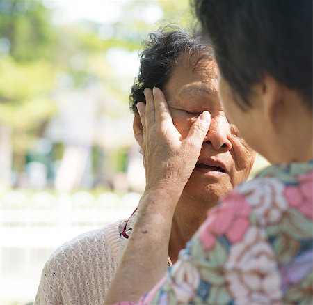 Candid shot of a mature woman consoling her tearful crying old mother at outdoor natural park. Stock Photo - Budget Royalty-Free & Subscription, Code: 400-06928941