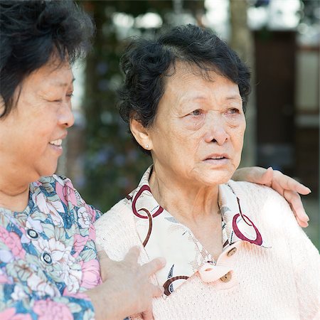 Asian mature woman consoling her crying old mother at outdoor natural green park. Stock Photo - Budget Royalty-Free & Subscription, Code: 400-06928957